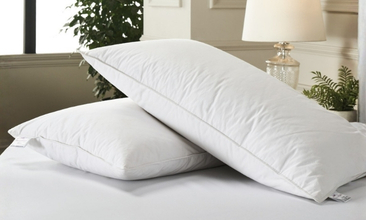 Luxury hotel pillows on elegantly made bed